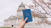 A hand holding a Letterfolk Passport. 