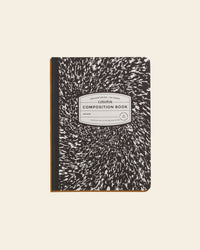 Composition Book in Black on a cream background