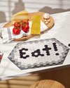 The Letterfolk Placemat on a kitchen counter top.