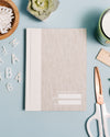 Abridged Journal in Oatmeal on a themed background