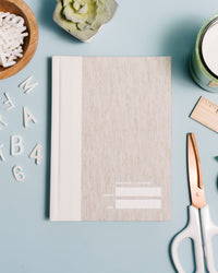 Abridged Journal in Oatmeal on a themed background