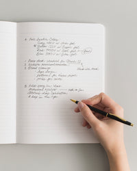 Composition Book in Black on a themed background
