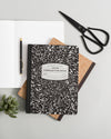 Composition Book on a themed background