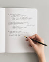 Composition Book on a themed background