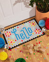 The Letterfolk Tile & Mat Set Advance Bundle designed on a Tile Mat in front of a doorway. 