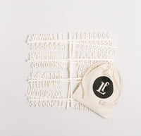 LF 3/4 inch Sans Letter Set in White on a cream background. 