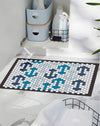 The Letterfolk Coastal Tile Set, Beginner's Bundle on a Tile Mat design on a tiled floor. 