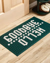The Letterfolk Standard Green Tile Mat design on a wodden floor.
