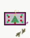 The Letterfolk Holiday Tile Set Design on a White Tile Mat on a white background. 