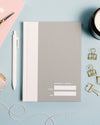 Abridged Journal in Grey on a themed background