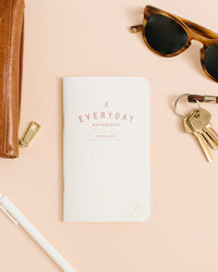 Everyday Checklist Notebook on a themed background