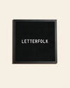 The Letterfolk Midnight Poet Letter Board on a cream background. 