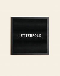 The Letterfolk Midnight Poet Letter Board on a cream background. 