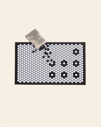 Letterfolk Standard Tile Mat in white on a cream background